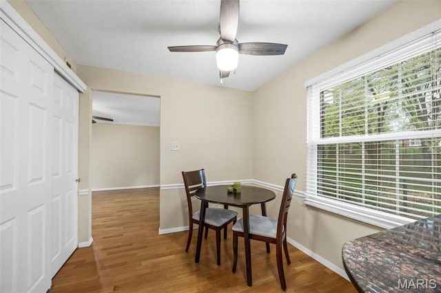 15038 Claymoor Ct Unit 2, Chesterfield, MO 63017 - dining space featuring wood finished floors, a ceiling fan, and baseboards