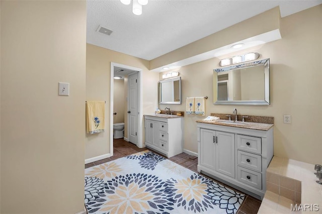 15038 Claymoor Ct Unit 2, Chesterfield, MO 63017 - full bathroom featuring vanity, baseboards, tile patterned flooring, and toilet