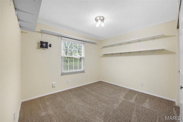 15038 Claymoor Ct Unit 2, Chesterfield, MO 63017 - empty room with carpet flooring, a textured ceiling, and baseboards