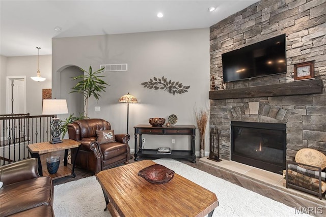 408 Hamlet Ct, Lake St Louis, MO 63367 - living area featuring a stone fireplace and arched walkways