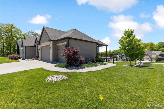 408 Hamlet Ct, Lake St Louis, MO 63367 - view of property exterior featuring a lawn, concrete driveway, an attached garage, and roof with shingles