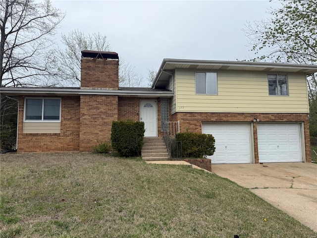 272 Vickie Lynn Ln, Saint Robert, MO 65584 - tri-level home with brick siding, an attached garage, a chimney, concrete driveway, and a front yard