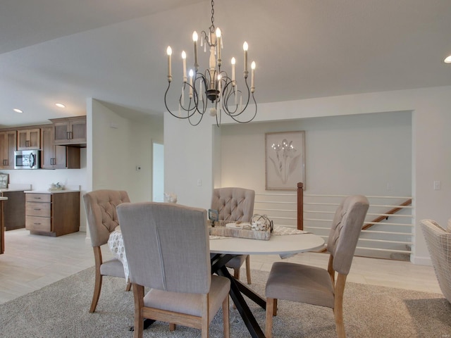 504 Timber View Ter, Hannibal, MO 63401 - dining space with recessed lighting, a chandelier, and light colored carpet