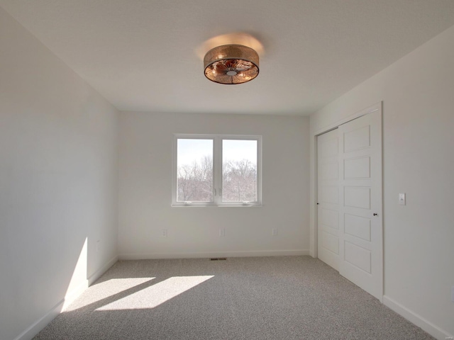 504 Timber View Ter, Hannibal, MO 63401 - unfurnished bedroom featuring light colored carpet and baseboards