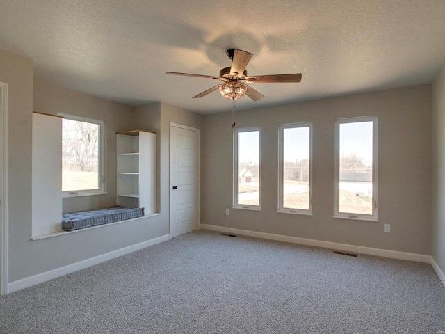 504 Timber View Ter, Hannibal, MO 63401 - carpeted spare room with baseboards and a ceiling fan