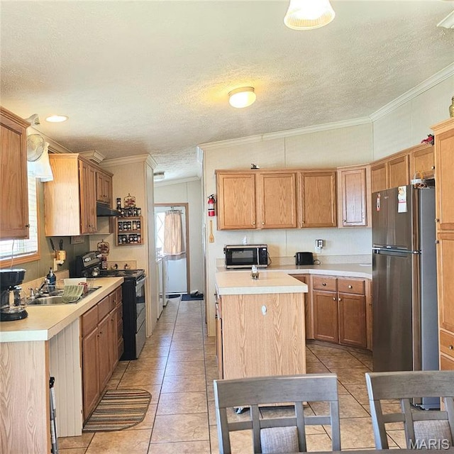 404 Garden St, Cahokia, IL 62206 - kitchen featuring stainless steel appliances, a sink, light countertops, under cabinet range hood, and light tile patterned floors