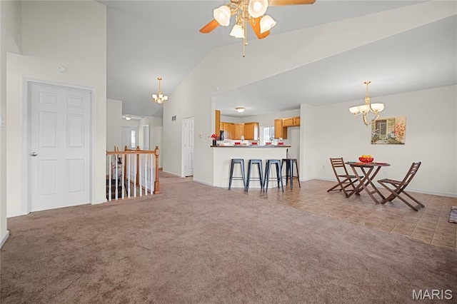 918 Fairway Dr, Union, MO 63084 - carpeted living room with a chandelier, a ceiling fan, high vaulted ceiling, baseboards, and healthy amount of natural light