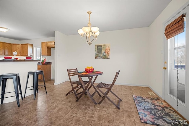 918 Fairway Dr, Union, MO 63084 - dining area with a chandelier and baseboards