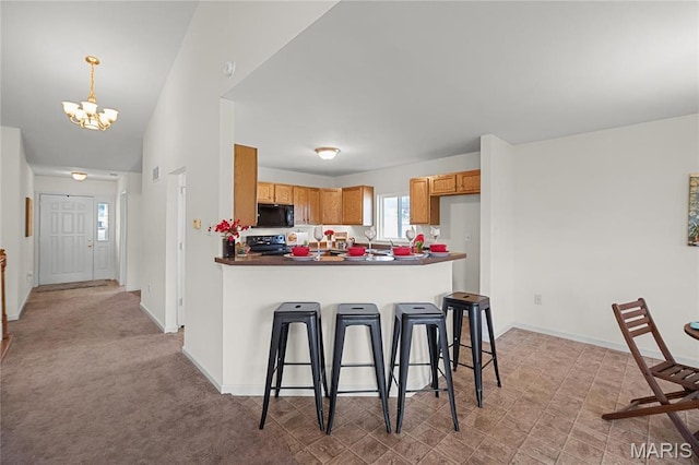 918 Fairway Dr, Union, MO 63084 - kitchen featuring black microwave, a chandelier, range, a peninsula, and a breakfast bar area