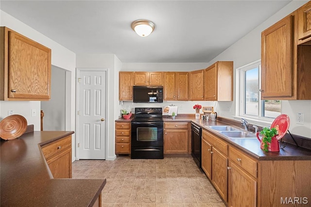 918 Fairway Dr, Union, MO 63084 - kitchen featuring black appliances, a sink, dark countertops, and brown cabinetry