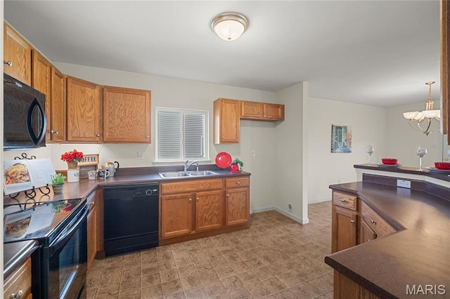 918 Fairway Dr, Union, MO 63084 - kitchen featuring black appliances, dark countertops, a sink, a chandelier, and brown cabinetry