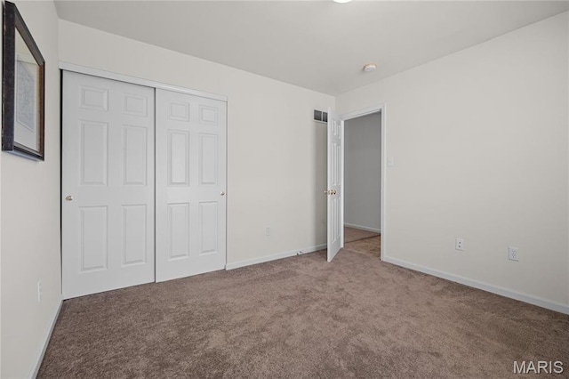918 Fairway Dr, Union, MO 63084 - unfurnished bedroom featuring carpet, a closet, and baseboards