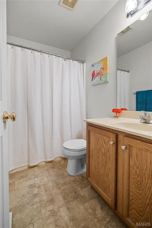 918 Fairway Dr, Union, MO 63084 - full bathroom with vanity, toilet, and stone finish floors