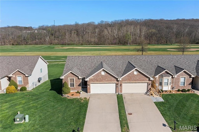 918 Fairway Dr, Union, MO 63084 - view of front of property with brick siding, an attached garage, a front lawn, and driveway