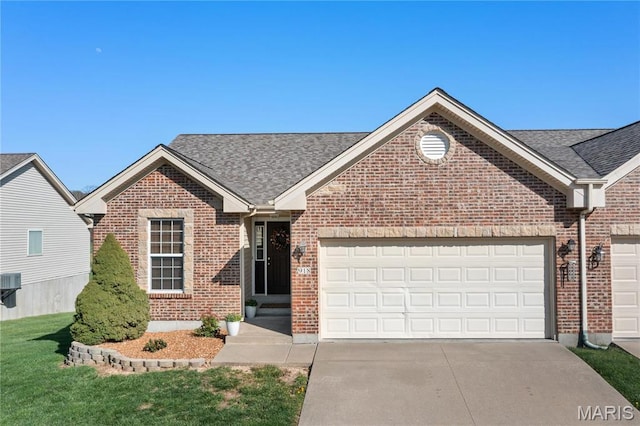 918 Fairway Dr, Union, MO 63084 - view of front of house featuring brick siding, driveway, an attached garage, and a shingled roof