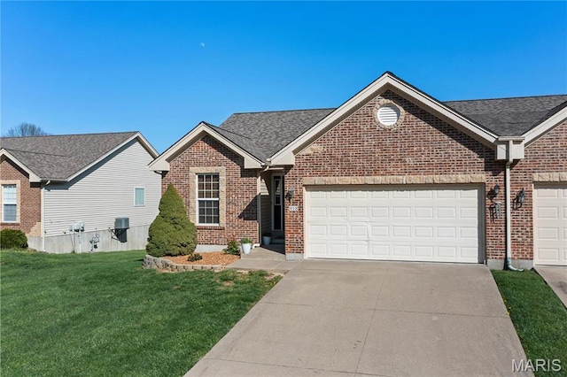 918 Fairway Dr, Union, MO 63084 - view of front of property with brick siding, concrete driveway, a front lawn, and an attached garage