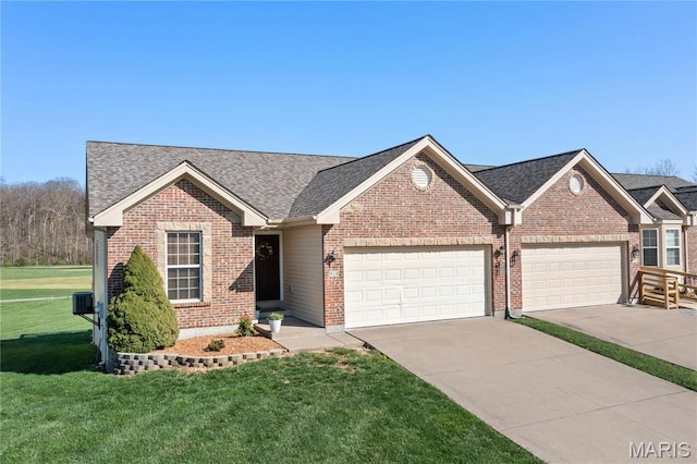 918 Fairway Dr, Union, MO 63084 - ranch-style house with a front yard, an attached garage, driveway, brick siding, and a shingled roof