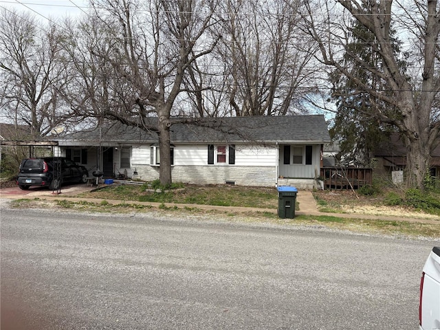 view of front facade featuring roof with shingles