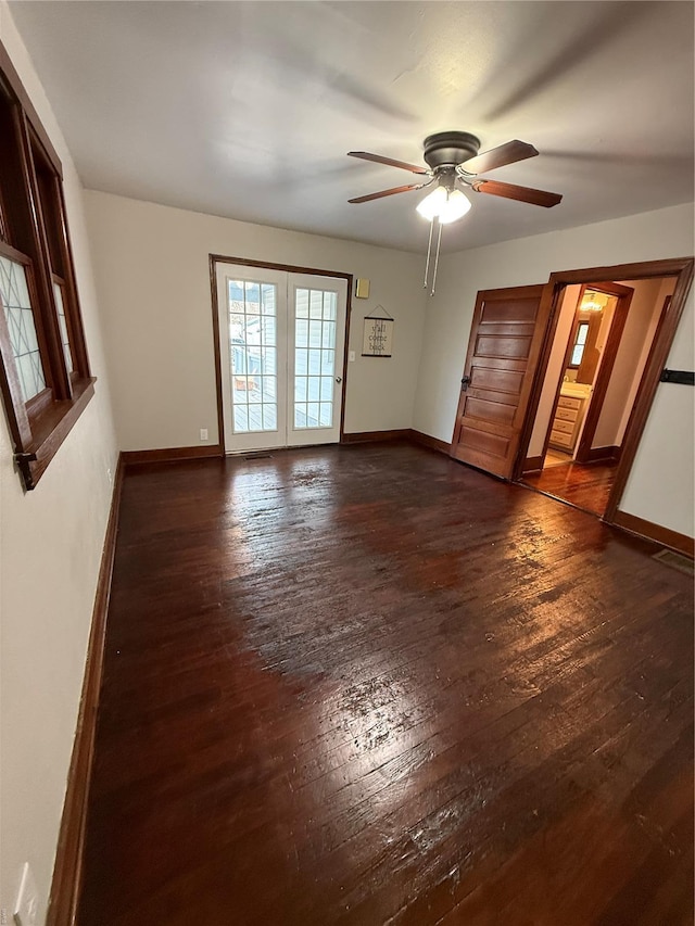 13978 Pike 496, Bowling Green, MO 63334 - spare room with dark wood finished floors, ceiling fan, and baseboards