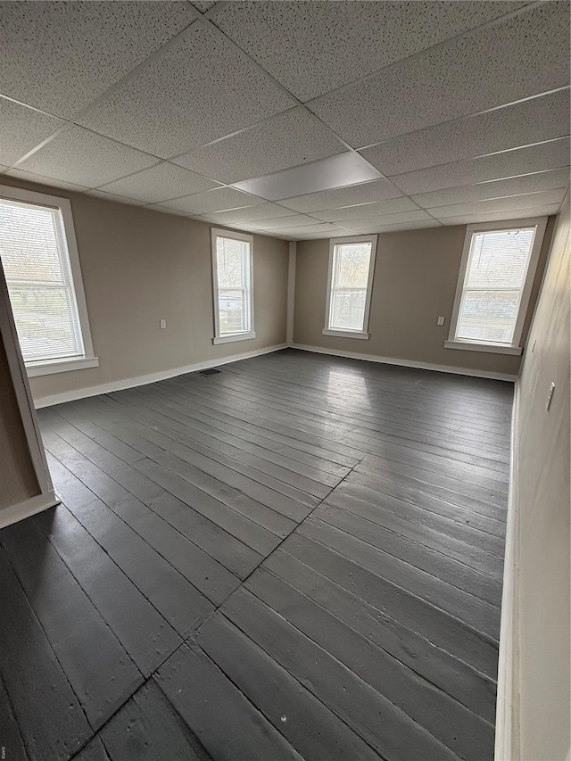 13978 Pike 496, Bowling Green, MO 63334 - unfurnished room with dark wood-style floors, baseboards, and a drop ceiling