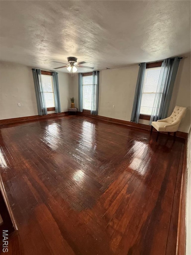 13978 Pike 496, Bowling Green, MO 63334 - spare room with a textured ceiling, hardwood / wood-style flooring, and a ceiling fan