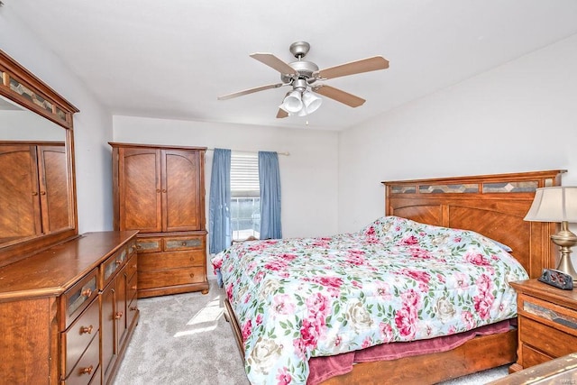bedroom featuring light colored carpet and a ceiling fan