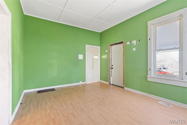 104 S 4th St, De Soto, MO 63020 - spare room with wood finished floors and baseboards