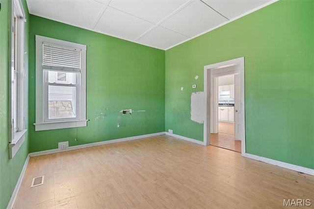 104 S 4th St, De Soto, MO 63020 - unfurnished room featuring wood finished floors and crown molding