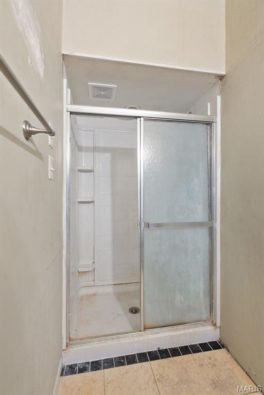 104 S 4th St, De Soto, MO 63020 - bathroom with a shower stall and tile patterned flooring