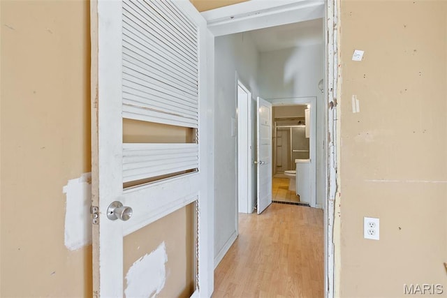 104 S 4th St, De Soto, MO 63020 - hallway featuring light wood-type flooring