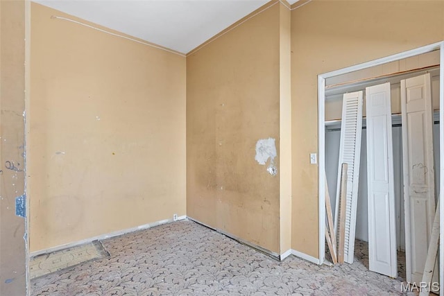104 S 4th St, De Soto, MO 63020 - unfurnished bedroom featuring baseboards