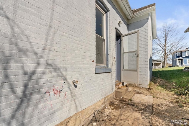 104 S 4th St, De Soto, MO 63020 - view of side of home featuring brick siding and entry steps