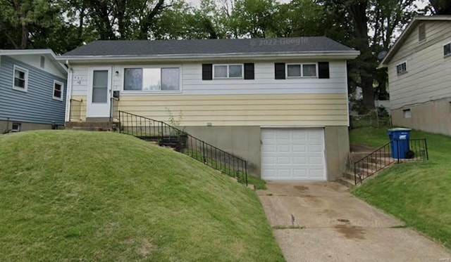 607 Superior Dr, Saint Louis, MO 63135 - view of front of home with a garage, entry steps, driveway, and a front yard