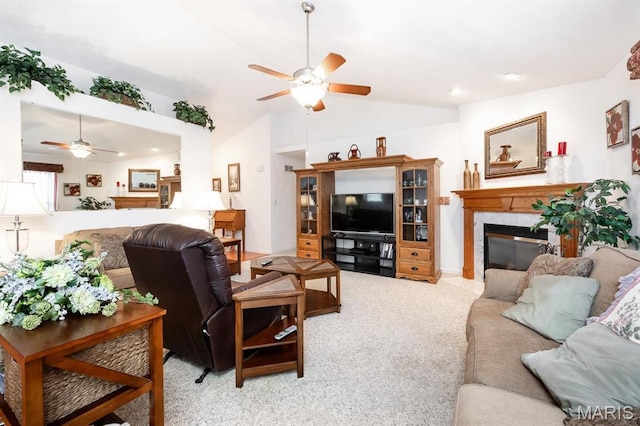 living room with ceiling fan, lofted ceiling, a fireplace, light colored carpet, and recessed lighting