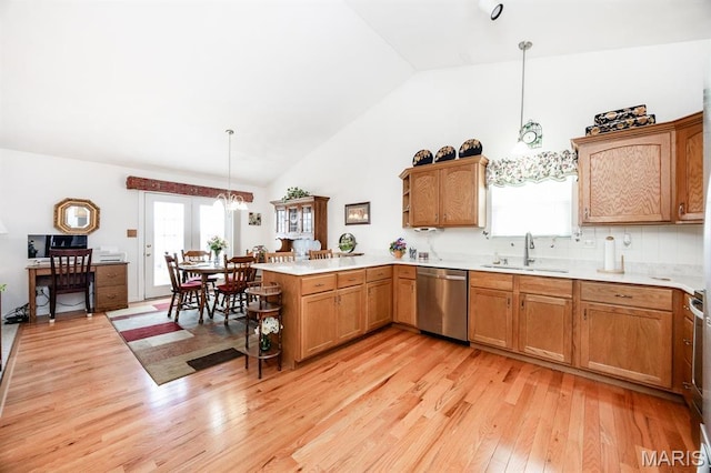 kitchen with dishwasher, a sink, a peninsula, light wood-type flooring, and open shelves