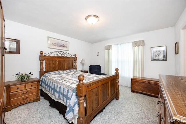bedroom with light colored carpet