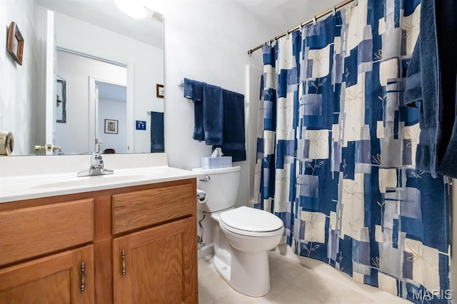 full bath with tile patterned flooring, toilet, vanity, and curtained shower