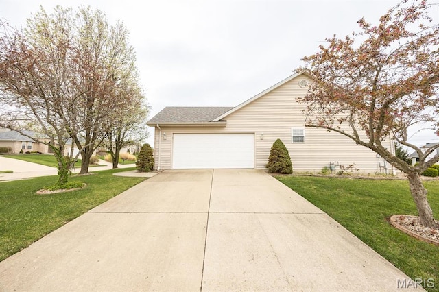 view of property exterior featuring concrete driveway, an attached garage, and a yard