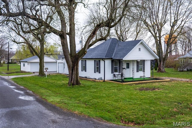 800 Frey St, Gillespie, IL 62033 - ranch-style home with covered porch, a garage, a front lawn, and a shingled roof
