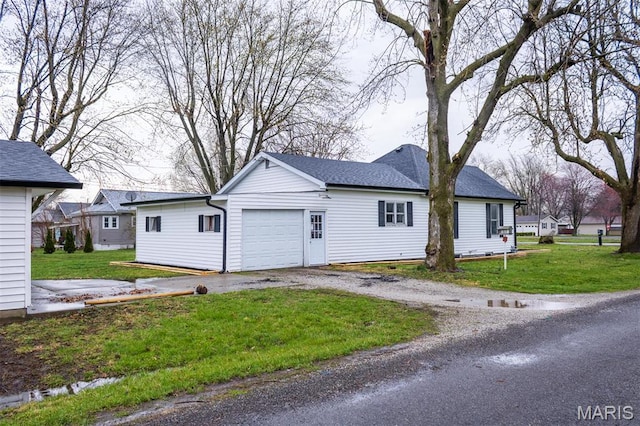 800 Frey St, Gillespie, IL 62033 - view of property exterior featuring a garage, driveway, a lawn, and a shingled roof