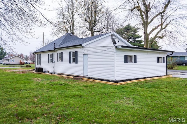 800 Frey St, Gillespie, IL 62033 - view of side of home with a lawn and central AC