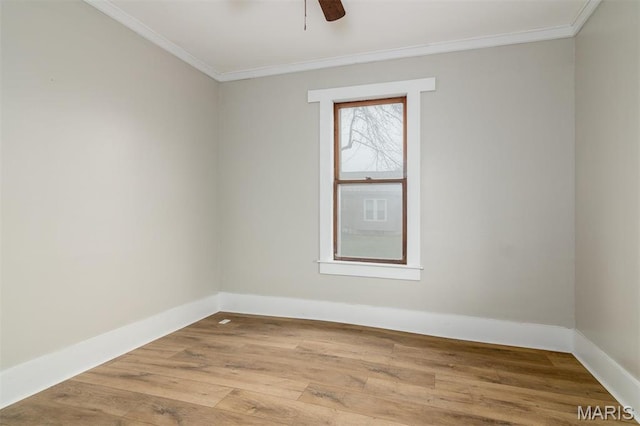 800 Frey St, Gillespie, IL 62033 - spare room with ornamental molding, baseboards, ceiling fan, and wood finished floors
