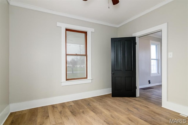 800 Frey St, Gillespie, IL 62033 - spare room with ornamental molding, wood finished floors, ceiling fan, and baseboards