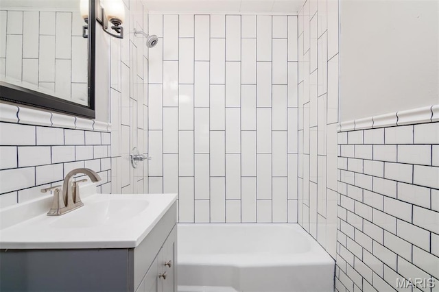 800 Frey St, Gillespie, IL 62033 - bathroom featuring tile walls, vanity, and shower / tub combination