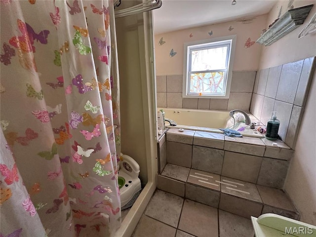2108 Chippewa St, Saint Louis, MO 63118 - bathroom with a shower stall, a garden tub, and tile patterned floors