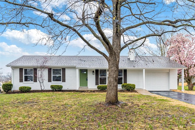 1121 E Cap Au Gris St, Troy, MO 63379 - ranch-style house with driveway, a garage, a chimney, and a front yard