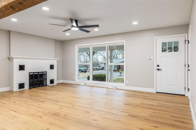 1121 E Cap Au Gris St, Troy, MO 63379 - unfurnished living room featuring light wood-style floors, ceiling fan, baseboards, a fireplace, and recessed lighting
