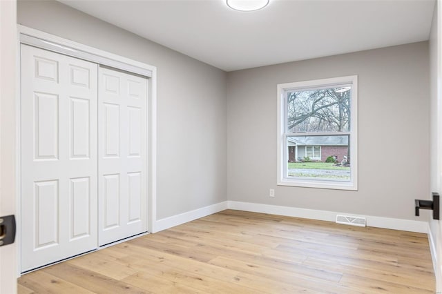 1121 E Cap Au Gris St, Troy, MO 63379 - unfurnished bedroom featuring light wood-style floors, baseboards, and a closet