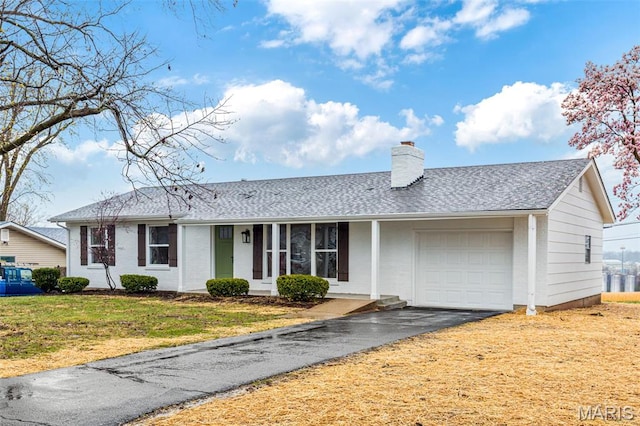 1121 E Cap Au Gris St, Troy, MO 63379 - single story home featuring a chimney, an attached garage, driveway, a front lawn, and roof with shingles