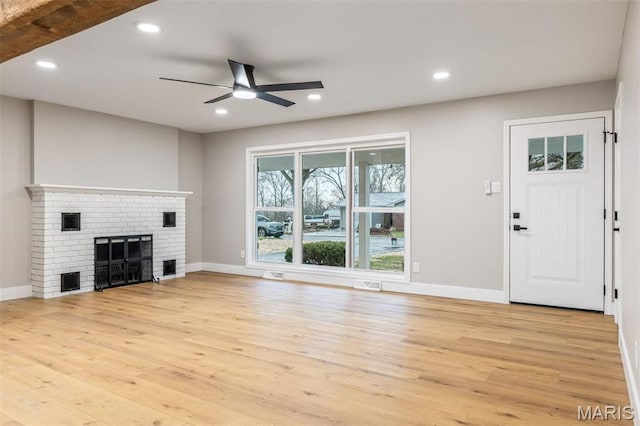1121 E Cap Au Gris St, Troy, MO 63379 - unfurnished living room with light wood-style floors, ceiling fan, baseboards, a brick fireplace, and recessed lighting